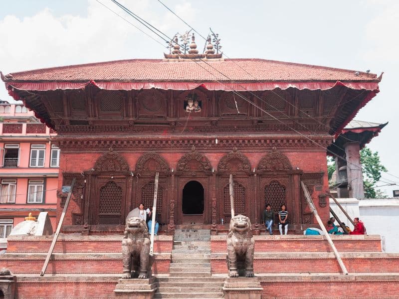 A detailed view of a historic temple in Kathmandu's Durbar Square featuring traditional architecture.