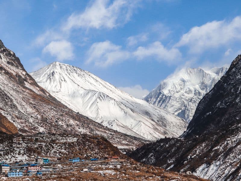 Majestic view of snow-covered peaks in Bagmati Province, Nepal, under a clear blue sky.