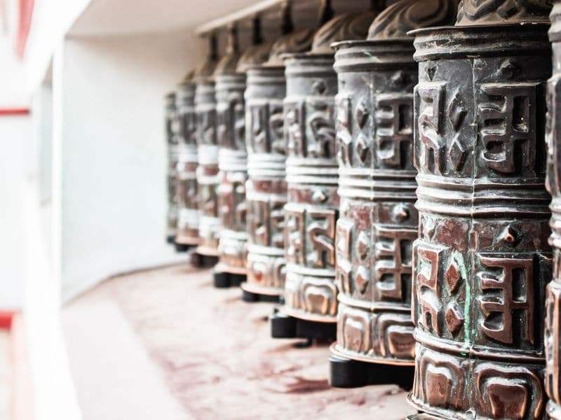 Close-up of traditional Buddhist prayer wheels in Kathmandu, Nepal.